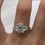 Thumbnail: 3 carat oval cut moissanite ring with half moon side stones