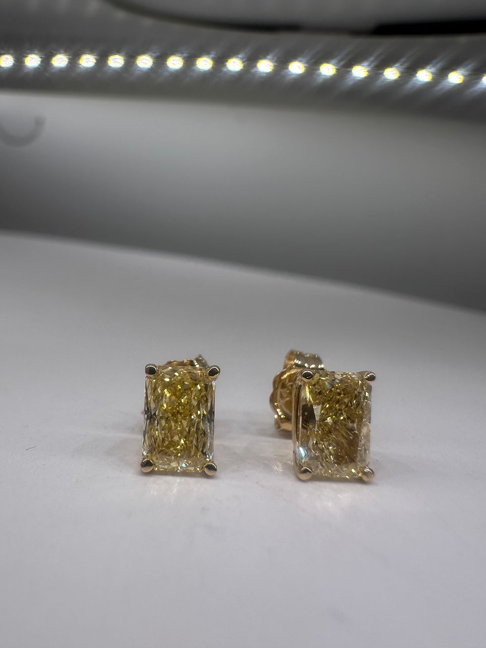 Thumbnail: 2.10 carat fancy intense yellow radiant cut stud lab diamond earrings 