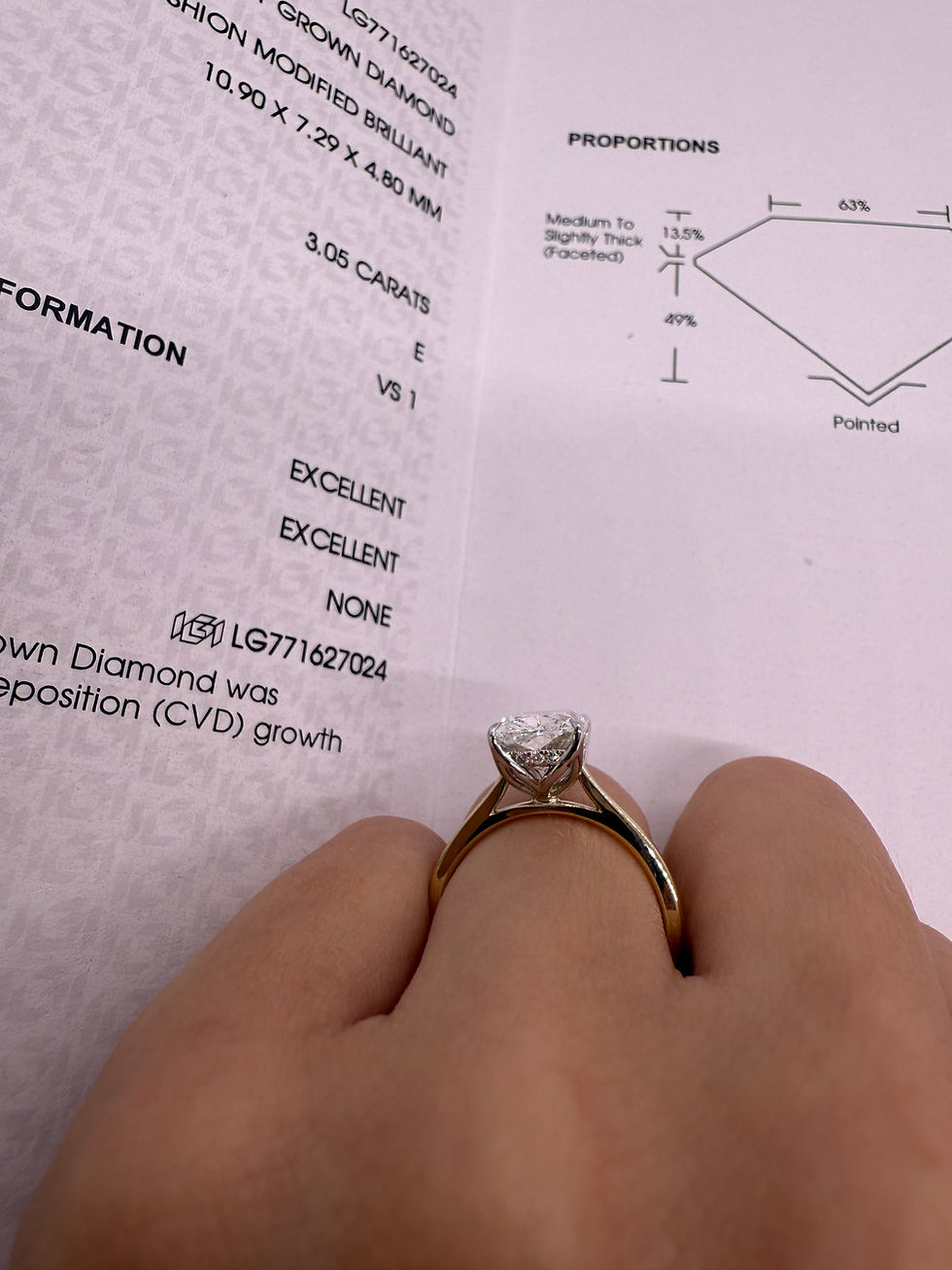 Thumbnail: 3.05 carat E VS1 elongated cushion solitaire with tulip basket and hidden halo 