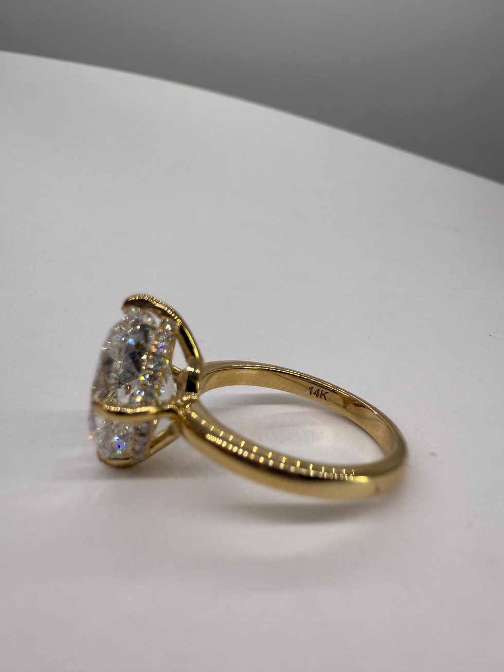 Thumbnail: 4.83 carat G VVS2 crushed ice oval lab diamond with compass prongs hidden halo