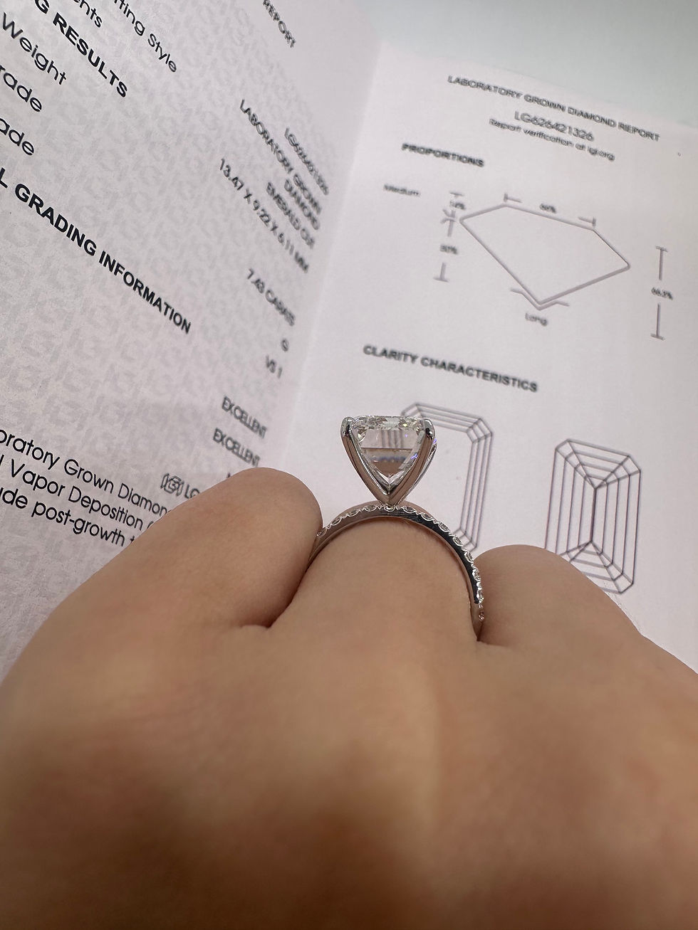 Thumbnail: 7.43 carat G VS1 emerald cut lab diamond on a pavé band 