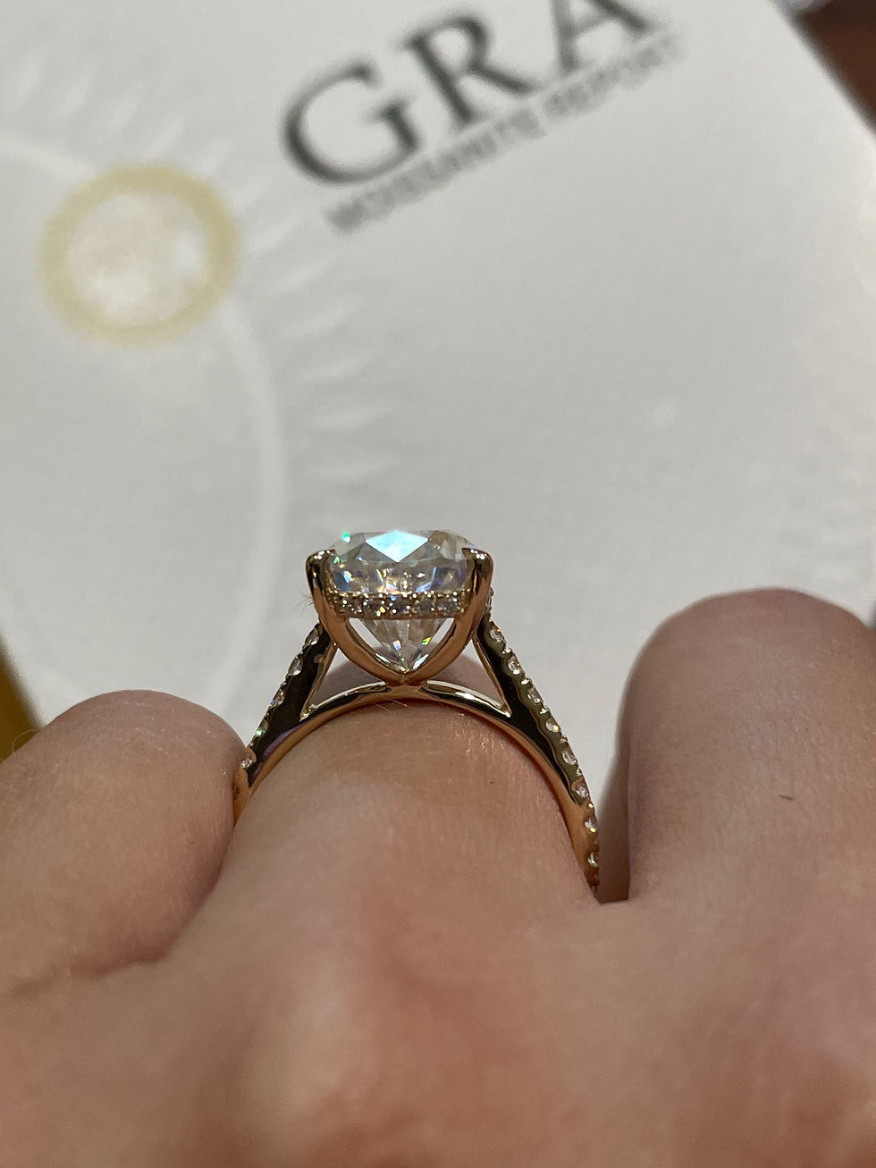 Thumbnail: 5 carat pear moissanite on a pavé band with hidden halo cathedral 14k yellow 