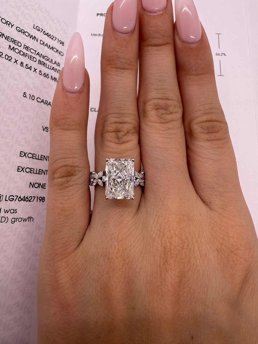 Thumbnail: 5.10 carat E VS1 radiant cut lab diamond with floral marquise and round diamon