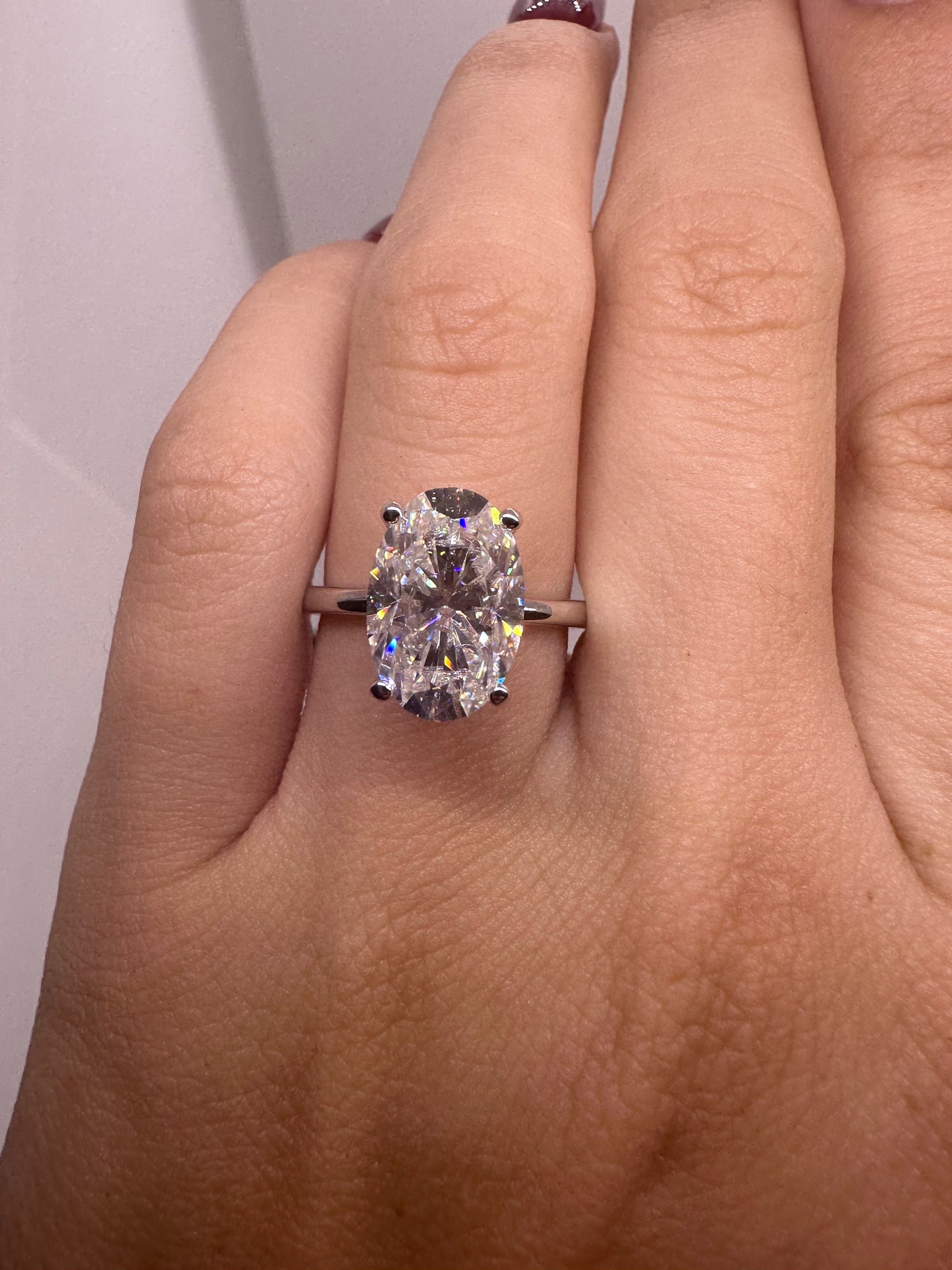 4.5 carat oval with pink sapphire hidden halo