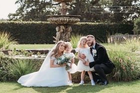 bride and groom and flower girls