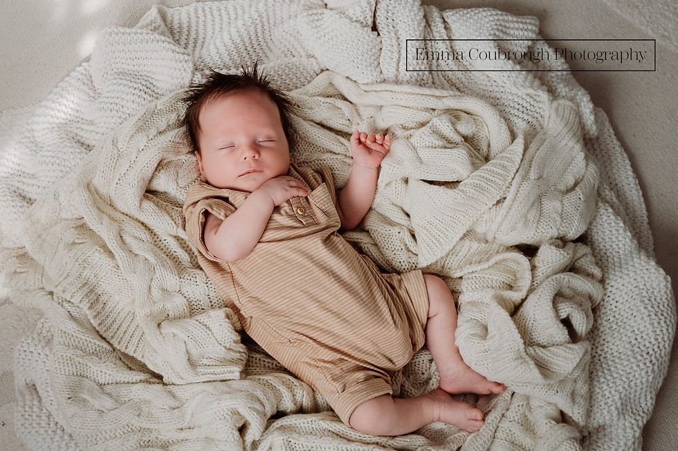 3 week old baby asleep on blankets