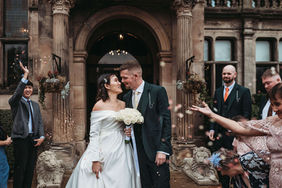 bride and groom with confetti being thrown at rookery hall