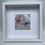 Thumbnail: Contemporary wall art featuring hand-painted red and blue twigs on textured wallpaper—designed to elevate modern interiors.