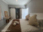 Modern weekend getaway accommodation bedroom with barn door.