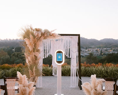 photobooth backdrop with pompous flowers