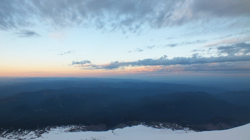 The clouds breaking up as the moon sets, with Hood’s shadow in the lower right of the frame.