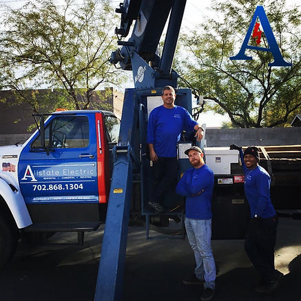 Electricians with service truck