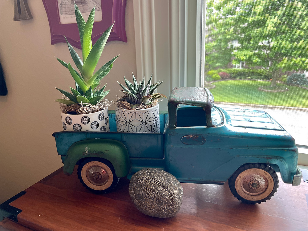 vintage truck with succulents & "grow" rock