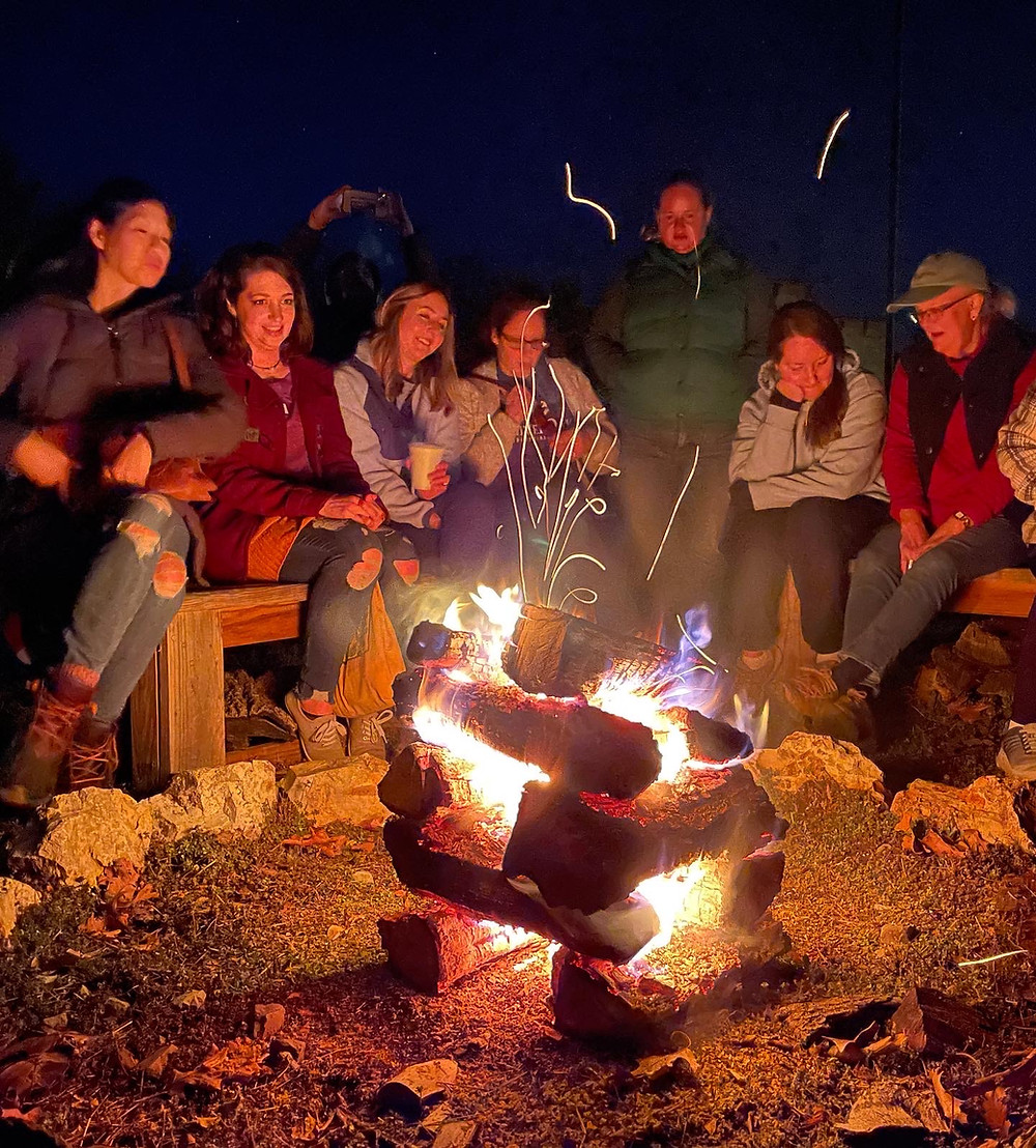 women around a campfire