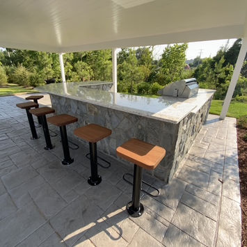 Stamped concrete outdoor kitchen designs by Greystone Masonry