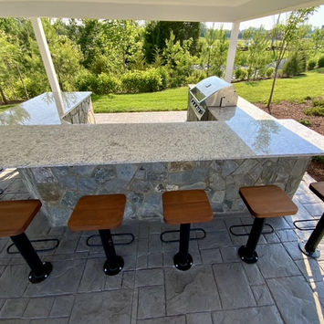 Stamped concrete outdoor kitchen designs by Greystone Masonry