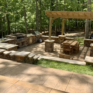 Stamped concrete outdoor kitchen designs by Greystone Masonry