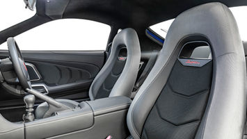 Toyota Supra interior with custom reupholstered seats, CAD-engineered panels, and 3D-printed accents by JK Automotive Designs.