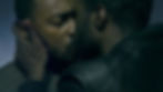 Black Man kissing another Black man