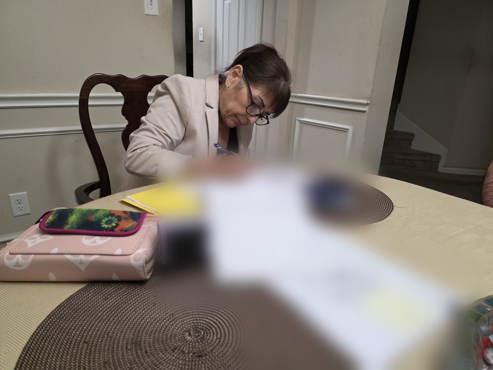 Mobile notary completing a refinance signing at a client's home in the Dallas–Fort Worth area