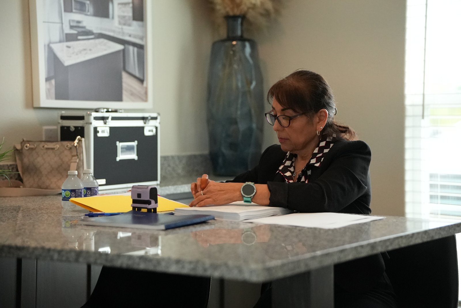 Mobile notary signing agent at the table for a real estate closing in Terrell, Texas