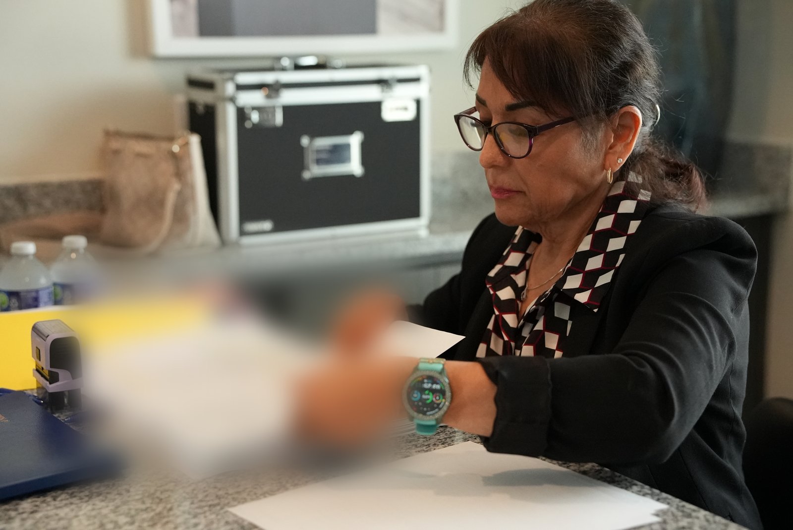PrimeSeal notary reviewing loan closing documents at a signing