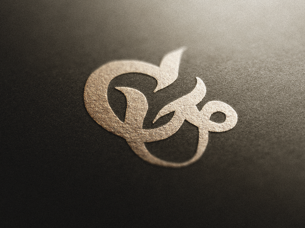 Stylish calligraphy of the "Letter G," featuring a flowing script.