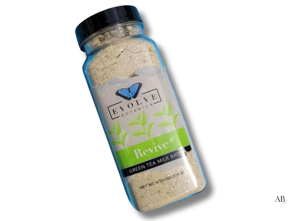 Evolve Botanica Revive Green Tea Milk Bath, bottle isolated on a white background.