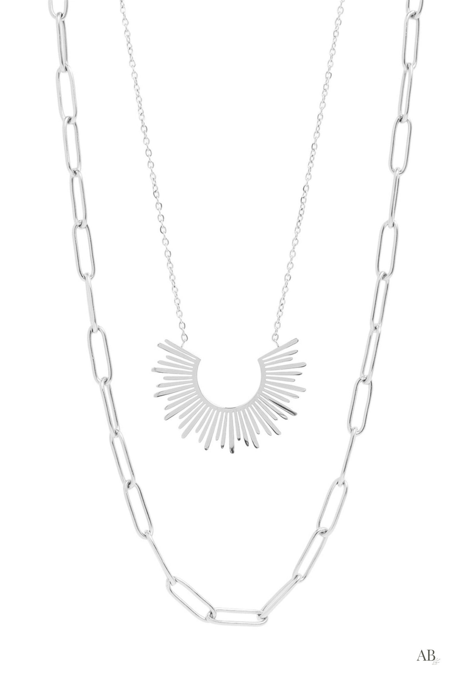 Hypoallergenic silver stainless steel double chain necklace combining a paperclip chain and sunburst charm flat layout.