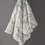 Thumbnail: Soft faux-fur heated throw blanket hanging on a wall hook in light gray pattern.