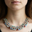 Thumbnail: Multi-stone wire statement collar necklace worn at neckline, bold beaded statement jewelry with colorful stones.