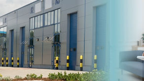 Ute in front of a commercial SMSF property fading to a real estate evaluation to keep the SMSF property compliant