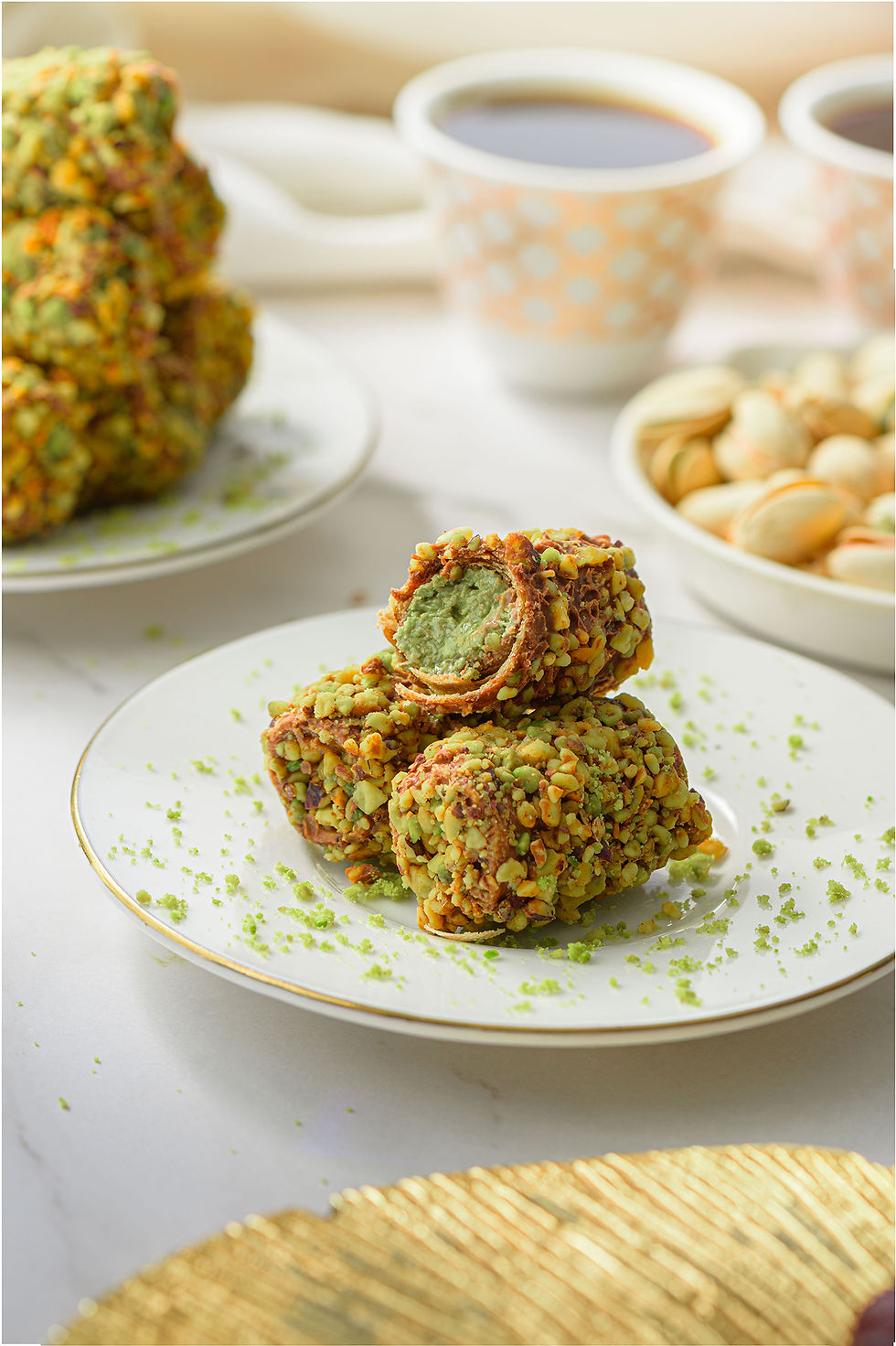 Pistachio kunafa roll dessert with golden pastry layers, styled and photographed in Dubai.