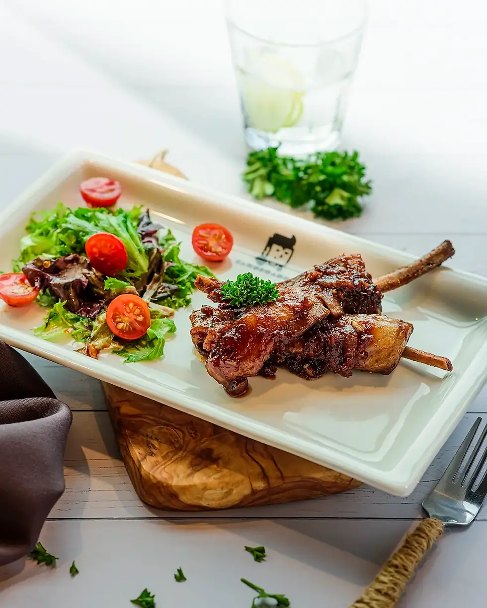 Best food photography lighting showcased in professional shot of BBQ ribs and fresh salad for commercial use