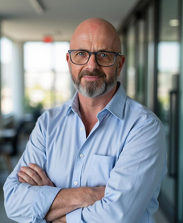 A headshot image of a nlp and hypnotherapy specialist wearing a smart blue shirt and glasses