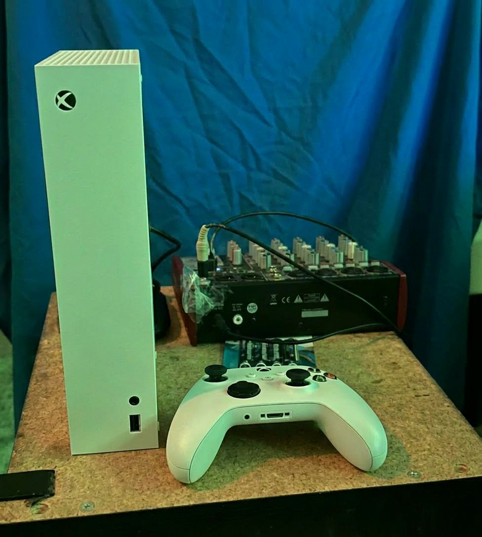 High angle view of a gaming console with vibrant game covers