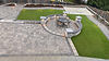 Hardscape installation with circular patio and outdoor dining