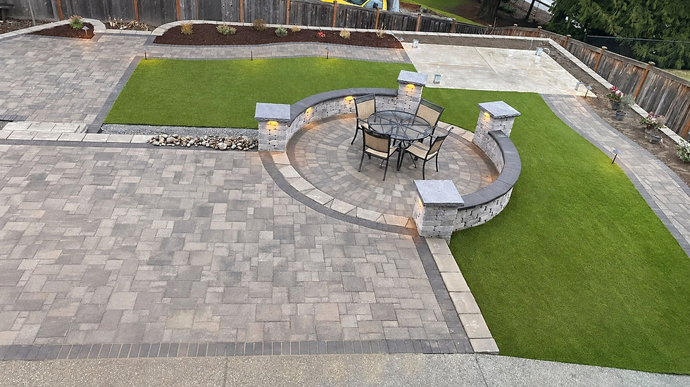 Modern paved patio with circular seating and artificial turf