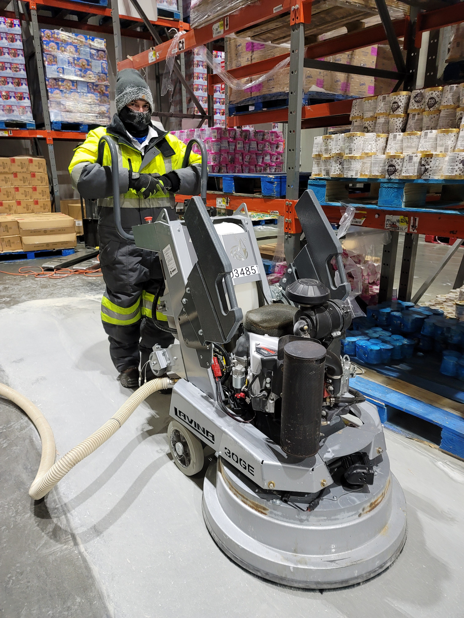 Industrial concrete grinding and polishing equipment in use