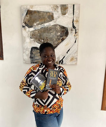 Brigitte Adofo Agyapong holding inspirational books