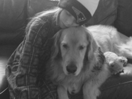 Sarah is thankful for her comfy PJ’s, Patriots hat …. and Mr. Marley!