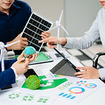 business-team-presenting-sustainable-city-model-wi-2026-01-09-11-40-21-utc.jpg