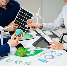 business-team-presenting-sustainable-city-model-wi-2026-01-09-11-40-21-utc.jpg