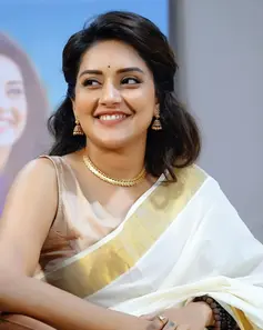 Mahima Nambiar wearing a Kasavu saree at a press meet, exuding traditional elegance.