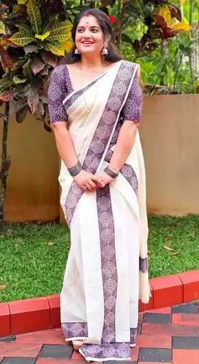 Shafna Nizam in coffee bean color chakra designer handloom cotton set mundu, traditional Kerala wear