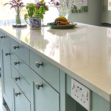 glacier blue schuller kitchen island and white worktop