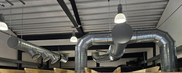 Extraction above large canopy to high level with exposed ductwork