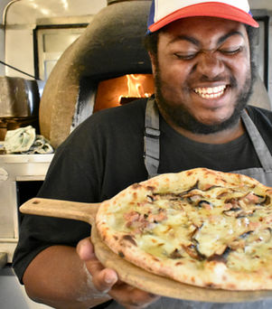 Carl in the wagon with pizza.jpeg