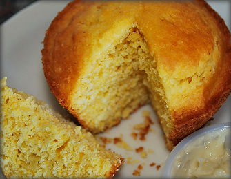 A sliced cornbread muffin