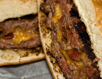 A big mouth burger cut in half